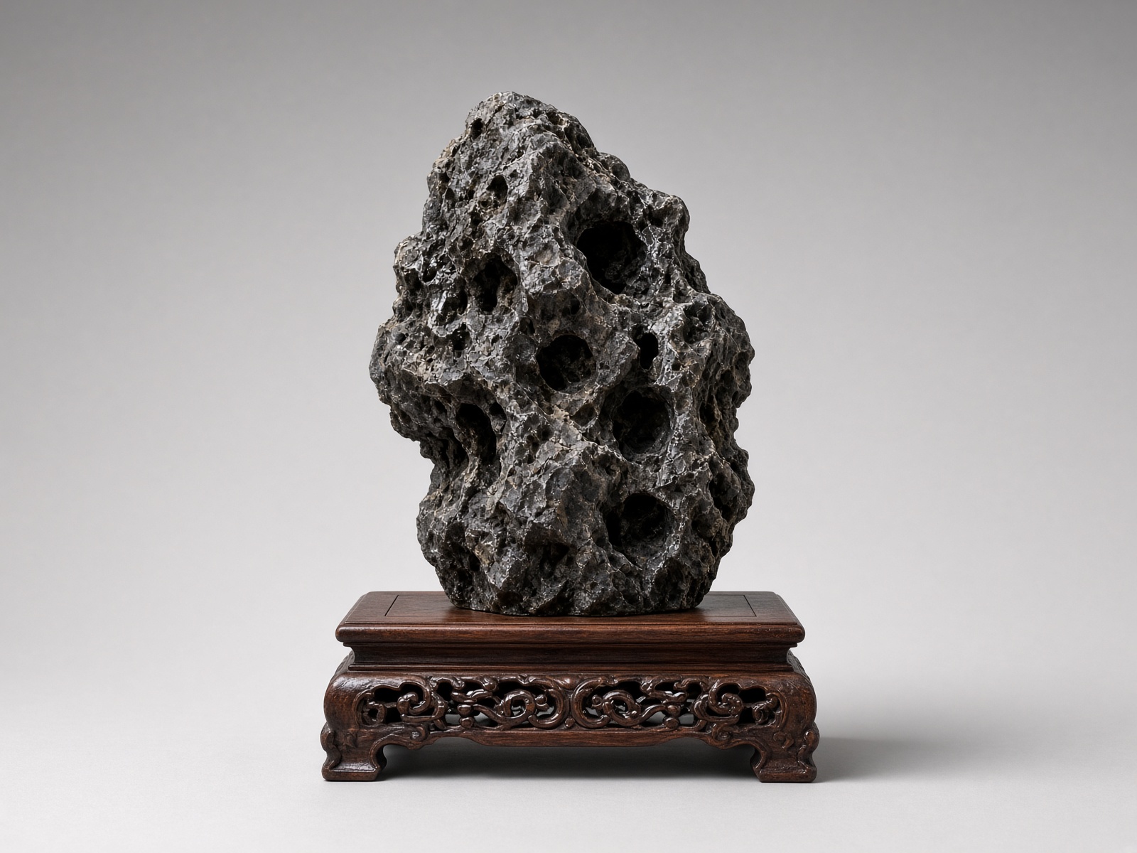 Lingbi scholar's rock on a hardwood stand